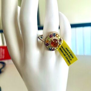 Elegant, natural fire opal ring with multicolored sapphires.